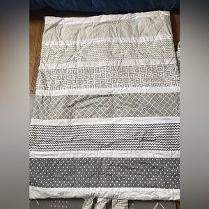 Gray and White Patterned Crib Sheet and Blanket